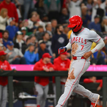Jul 22, 2024; Seattle, Washington, USA; Los Angeles Angels right fielder Jo Adell (7) scores a run against the Seattle Mariners during the eighth inning at T-Mobile Park. Mandatory Credit: Steven Bisig-USA TODAY Sports