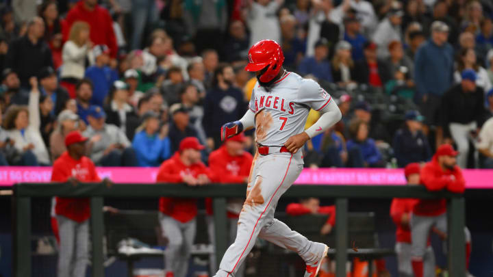 Jul 22, 2024; Seattle, Washington, USA; Los Angeles Angels right fielder Jo Adell (7) scores a run against the Seattle Mariners during the eighth inning at T-Mobile Park. Mandatory Credit: Steven Bisig-USA TODAY Sports