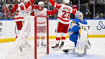 Oct 28, 2025; St. Louis, Missouri, USA; Detroit Red Wings right wing Alex Debrincat (93) is congratulated by teammates after scoring against St. Louis Blues goaltender Jordan Binnington (50) during the first period at Enterprise Center. Mandatory Credit: Jeff Curry-Imagn Images