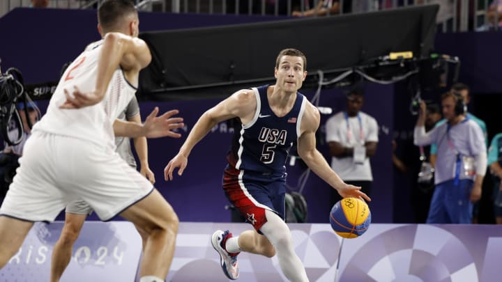 Jul 30, 2024; Paris, France; United States player Jimmer Fredette (5) controls the ball against Serbia in the men’s pool basketball 3x3 game during the Paris 2024 Olympic Summer Games at La Concorde 1. Mandatory Credit: Yukihito Taguchi-USA TODAY Sports