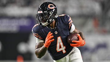 Dec 16, 2024; Minneapolis, Minnesota, USA; Chicago Bears running back D'Andre Swift (4) runs the ball against the Minnesota Vikings during the third quarter at U.S. Bank Stadium. Mandatory Credit: Jeffrey Becker-Imagn Images