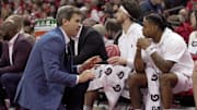 Wisconsin special assistant to the head coach Kirk Penney speaks with guard Kamari McGee during the first half of their game Tuesday, February 18, 2025 at the Kohl Center in Madison, Wisconsin.