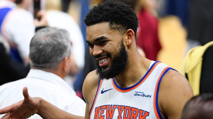 May 23, 2026; Cleveland, Ohio, USA; New York Knicks center Karl-Anthony Towns (32)  high fives teammates after defeating the Cleveland Cavaliers in game three of the eastern conference finals for the 2026 NBA playoffs at Rocket Arena. Mandatory Credit: David Richard-Imagn Images
