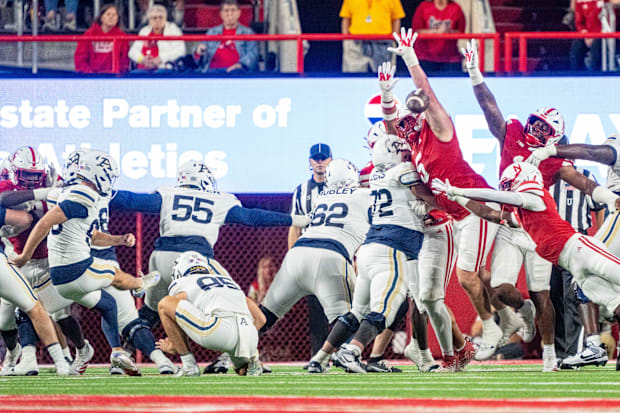 Nebraska Cornhuskers defensive lineman Riley Van Poppel blocks a field goal kick by Akron Zips place kicker Owen Wiley.