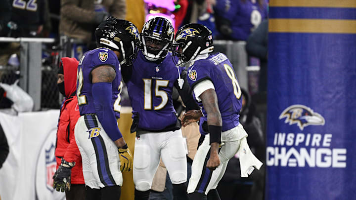 Baltimore Ravens running back Derrick Henry (22) celebrates with wide receiver Nelson Agholor and quarterback Lamar Jackson