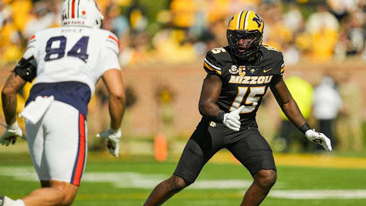 Oct 19, 2024; Columbia, Missouri, USA; Missouri Tigers defensive end Johnny Walker Jr. (15) defends Auburn Tigers tight end Micah Riley (84) during the second half at Faurot Field at Memorial Stadium. Mandatory Credit: Jay Biggerstaff-Imagn Images