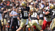 Purdue Boilermakers quarterback Ryan Browne (15) throws a pass