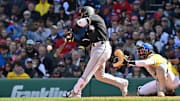 Chicago White Sox catcher Edgar Quero (7) hits a two-run RBI single in the seventh inning against the Boston Red Sox at Fenway Park. 