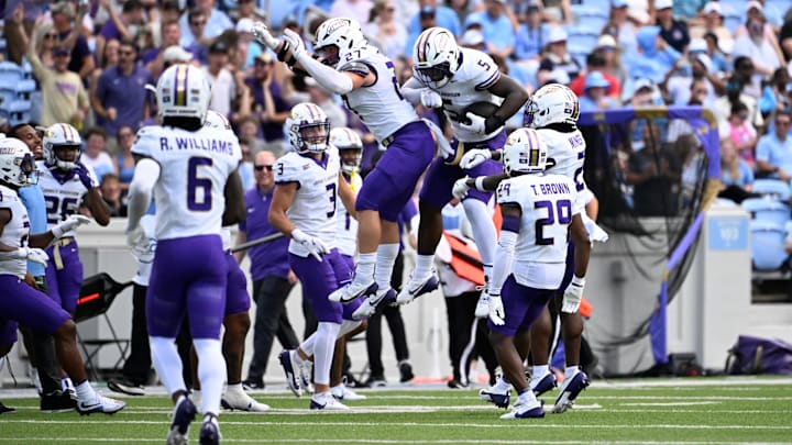 James Madison Dukes linebacker Jacob Dobbs and linebacker Trent Hendrick celebrate in the first quarter of Saturday's game against North Carolina at Kenan Memorial Stadium.