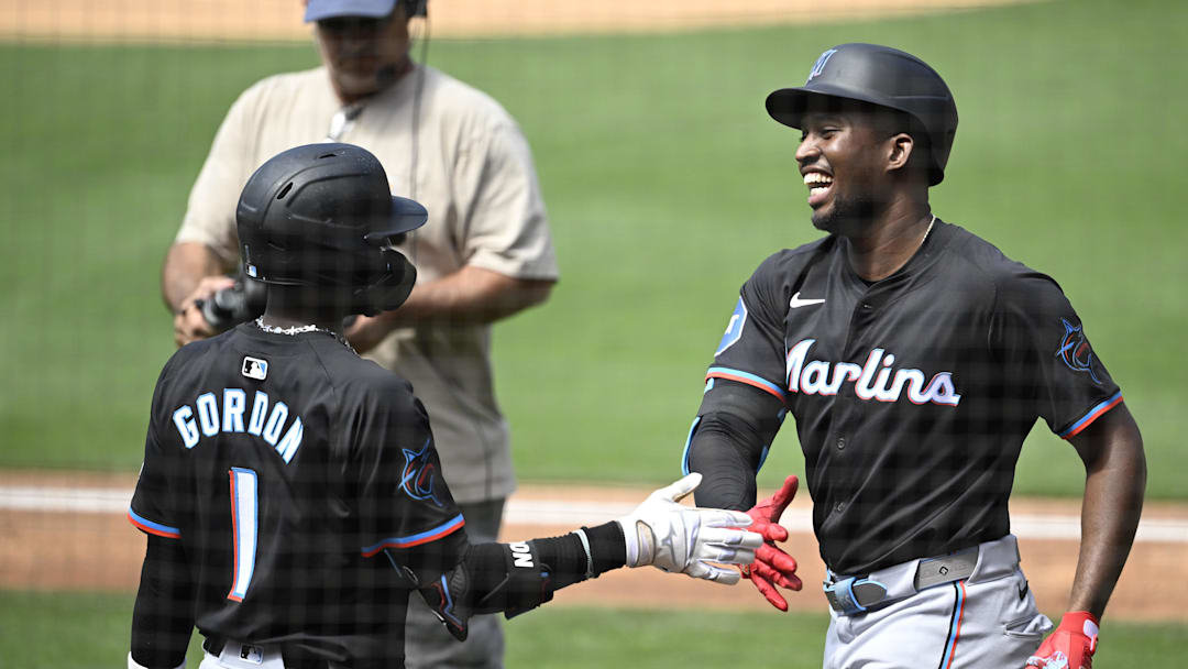 Miami Marlins outfielder Jesús Sanchez (12), right, is congratulated by Nick Gordon (1) after hitting a solo home run during the sixth inning against the San Diego Padres at Petco Park