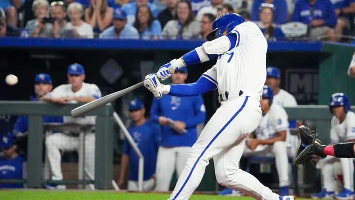 Aug 20, 2024; Kansas City, Missouri, USA; Kansas City Royals shortstop Bobby Witt Jr. (7) hits a one-run double against the Los Angeles Angels in the seventh inning at Kauffman Stadium. Mandatory Credit: Denny Medley-USA TODAY Sports