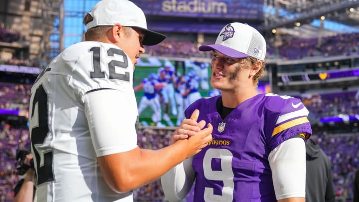 Minnesota Vikings quarterback J.J. McCarthy (9) and Las Vegas Raiders quarterback Aidan O'Connell (12) talk 