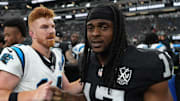 Sep 22, 2024; Paradise, Nevada, USA; Carolina Panthers quarterback Andy Dalton (14) shakes hands with Las Vegas Raiders wide receiver Davante Adams (17) after the game at Allegiant Stadium. Mandatory Credit: Kirby Lee-Imagn Images