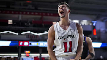 Nov 3, 2025; Cincinnati, Ohio, USA;  Cincinnati Bearcats guard Kerr Kriisa (11) reacts after a turnover by the Western Carolina Catamounts in the second half at Fifth Third Arena. Mandatory Credit: Aaron Doster-Imagn Images