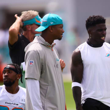 Jul 28, 2024; Miami Gardens, FL, USA; Miami Dolphins wide receiver Tyreek Hill (10) signals during training camp at Baptist Health Training Complex. 