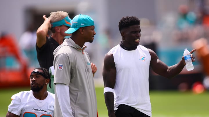 Jul 28, 2024; Miami Gardens, FL, USA; Miami Dolphins wide receiver Tyreek Hill (10) signals during training camp at Baptist Health Training Complex. 