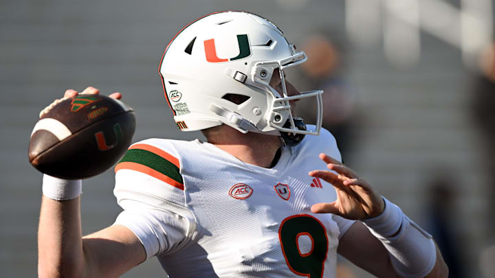 Nov 24, 2023; Chestnut Hill, Massachusetts, USA; Miami Hurricanes quarterback Tyler Van Dyke (9) makes a pass during warmups before a game against the Boston College Eagles at Alumni Stadium. Mandatory Credit: Brian Fluharty-Imagn Images