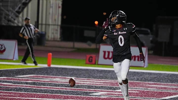 Red Mountain cornerback Tyreke Cornett celebrates an interception returned for a touchdown against Downey (CA) during the Honor Bowl game at Red Mountain High School on Sept. 20, 2024.