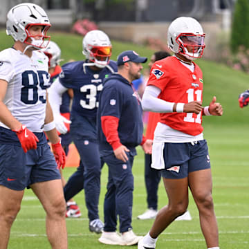 Jun 9, 2025; Foxborough, MA, USA; New England Patriots quarterback Joshua Dobbs (11) warms up at minicamp at Gillette Stadium. Mandatory Credit: Eric Canha-Imagn Images