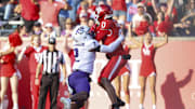 Nov 22, 2025; Houston, Texas, USA; Houston Cougars wide receiver Amare Thomas (0) makes a reception for a touchdown as TCU Horned Frogs safety Jamel Johnson (2) defends during the second quarter at TDECU Stadium. Mandatory Credit: Troy Taormina-Imagn Images