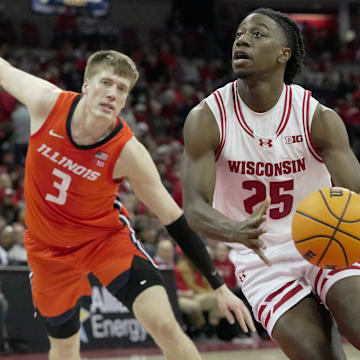 Wisconsin guard John Blackwell (25) drives past Illinois forward Ben Humrichous (3) during the second half of their game Tuesday, February 18, 2025 at the Kohl Center in Madison, Wisconsin. Wisconsin beat Illinois 95-74.