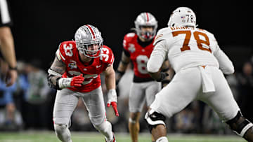 Jan 10, 2025; Arlington, TX, USA; Ohio State Buckeyes defensive end Jack Sawyer (33) rushes against Texas Longhorns offensive lineman Kelvin Banks Jr. (78) during the game at AT&T Stadium. Mandatory Credit: Jerome Miron-Imagn Images