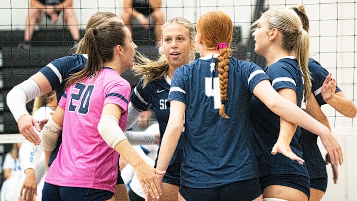 Pleasant Valley players celebrate after a point during a tournament at Ankeny Centennial High School on Aug. 30, 2025, in Ankeny.