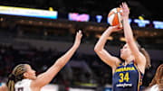 Indiana Fever guard Grace Berger (34) shoots the ball against Atlanta Dream guard Haley Jones (13).