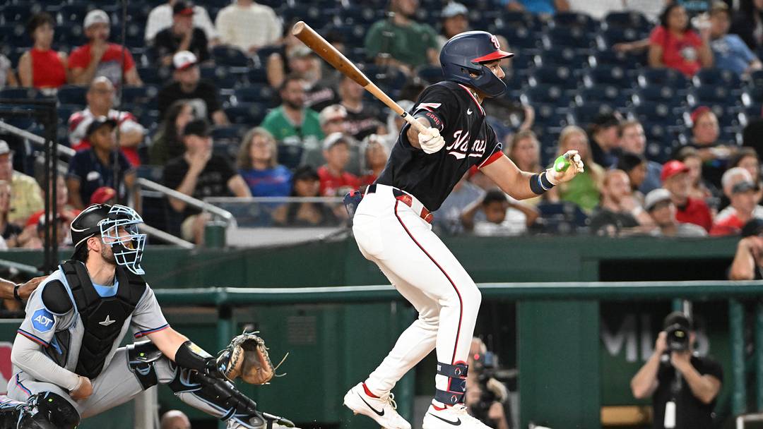 Aug 28, 2026; Washington, District of Columbia, USA; Washington Nationals left fielder Daylen Lile (4) hits a RBI triple against the Miami Marlinsduring the seventh inning at Nationals Park. Mandatory Credit: Brad Mills-Imagn Images