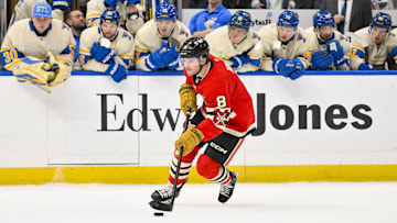 Feb 8, 2025; St. Louis, Missouri, USA;  Chicago Blackhawks center Ryan Donato (8) controls the puck against the St. Louis Blues during shootouts at Enterprise Center. Mandatory Credit: Jeff Curry-Imagn Images