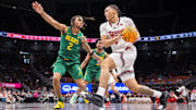 Mar 13, 2025; Kansas City, MO, USA; Texas Tech Red Raiders forward Darrion Williams (5) drives to the basket around Baylor Bears guard Jayden Nunn (2) during the first half at T-Mobile Center.