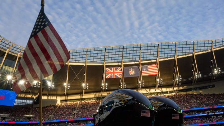 Oct 8, 2023; London, United Kingdom;  Flags and helmets in the evening sun during the second half of an NFL International Series game at Tottenham Hotspur Stadium. Mandatory Credit: Peter van den Berg-USA TODAY Sports