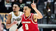 Wisconsin Badgers guard John Tonje (9) celebrates making a basket 