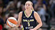Jun 27, 2025; Dallas, Texas, USA; Dallas Wings guard Paige Bueckers (5) brings the ball up court against the Indiana Fever during the second quarter at the American Airlines Center. Mandatory Credit: Jerome Miron-Imagn Images