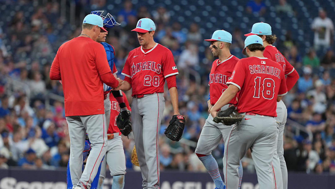 Jul 4, 2025; Toronto, Ontario, CAN; Los Angeles Angels pitcher Kyle Hendricks (28) is relieved by interim manager Ray Montgomery (81) against the Toronto Blue Jays during the sixth inning at Rogers Centre. Mandatory Credit: Nick Turchiaro-Imagn Images