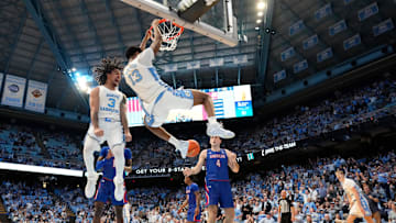 Nov 15, 2024; Chapel Hill, North Carolina, USA; North Carolina Tar Heels guard Elliot Cadeau (3) reacts as forward Jalen Washington (13) dunks the ball in the second half at Dean E. Smith Center. Mandatory Credit: Bob Donnan-Imagn Images