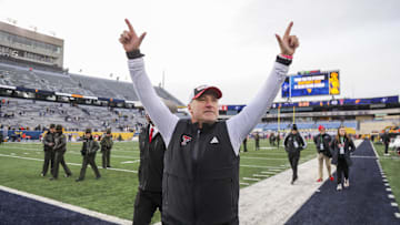 Nov 29, 2025; Morgantown, West Virginia, USA; Texas Tech Red Raiders head coach Joey McGuire celebrates with fans after defeating the West Virginia Mountaineers at Milan Puskar Stadium. Mandatory Credit: Ben Queen-Imagn Images