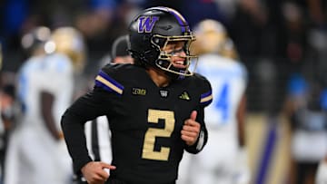 Nov 15, 2024; Seattle, Washington, USA; Washington Huskies quarterback Demond Williams Jr. (2) smiles after throwing a touchdown against the UCLA Bruins during the second half at Alaska Airlines Field at Husky Stadium. Mandatory Credit: Steven Bisig-Imagn Images