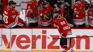 Mar 30, 2025; Chicago, Illinois, USA;  Chicago Blackhawks center Joe Veleno (90) celebrates with teammates  after he scores against Utah Hockey Club during the second period at United Center. Mandatory Credit: Matt Marton-Imagn Images