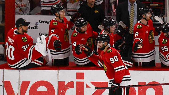 Mar 30, 2025; Chicago, Illinois, USA;  Chicago Blackhawks center Joe Veleno (90) celebrates with teammates  after he scores against Utah Hockey Club during the second period at United Center. Mandatory Credit: Matt Marton-Imagn Images