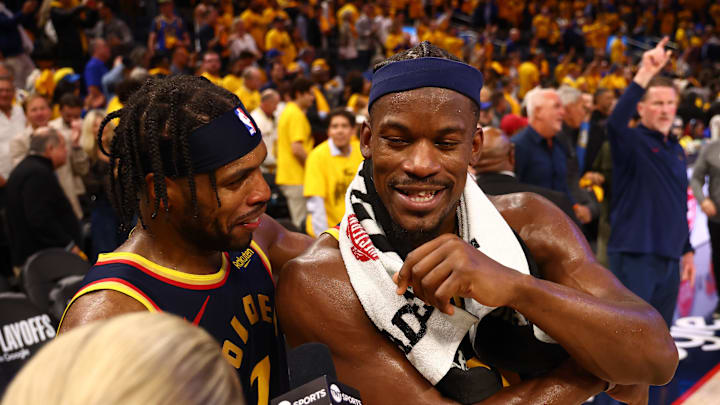 Apr 28, 2025; San Francisco, California, USA; Golden State Warriors guard Buddy Hield (7) celebrates with forward Jimmy Butler III (10) as he speaks to TNT after the game four of the 2025 NBA Playoffs first round against the Houston Rockets at Chase Center. Mandatory Credit: Kelley L Cox-Imagn Images