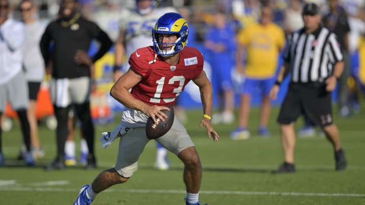 Jul 29, 2024; Los Angeles, CA, USA; Los Angeles Rams quarterback Stetson Bennett (13) participates in drills during training camp at Loyola Marymount University. Mandatory Credit: Jayne Kamin-Oncea-USA TODAY Sports