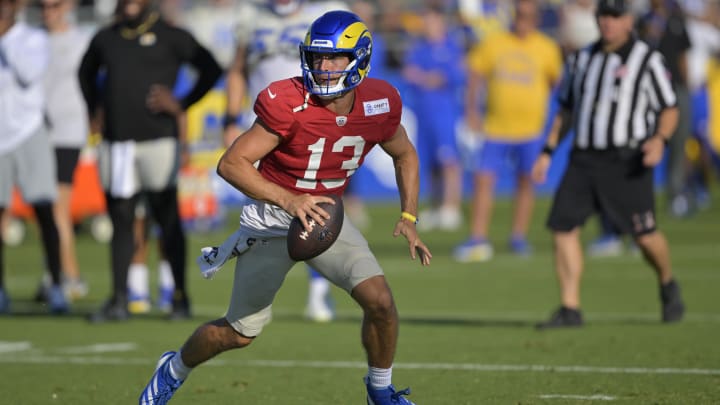 Jul 29, 2024; Los Angeles, CA, USA; Los Angeles Rams quarterback Stetson Bennett (13) participates in drills during training camp at Loyola Marymount University. Mandatory Credit: Jayne Kamin-Oncea-USA TODAY Sports