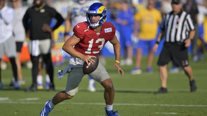 Jul 29, 2024; Los Angeles, CA, USA; Los Angeles Rams quarterback Stetson Bennett (13) participates in drills during training camp at Loyola Marymount University. Mandatory Credit: Jayne Kamin-Oncea-USA TODAY Sports