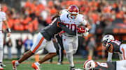 Nov 1, 2025; Corvallis, Oregon, USA; Washington State Cougars running back Leo Pulalasi (20) runs the ball in the grasp of Oregon State Beavers defensive back Skyler Thomas (17) during the first quarter at Reser Stadium. Mandatory Credit: Craig Strobeck-Imagn Images