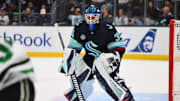 Mar 30, 2024; Seattle, Washington, USA; Seattle Kraken goaltender Joey Daccord (35) defends the goal against the Dallas Stars during the first period at Climate Pledge Arena. Mandatory Credit: Steven Bisig-Imagn Images