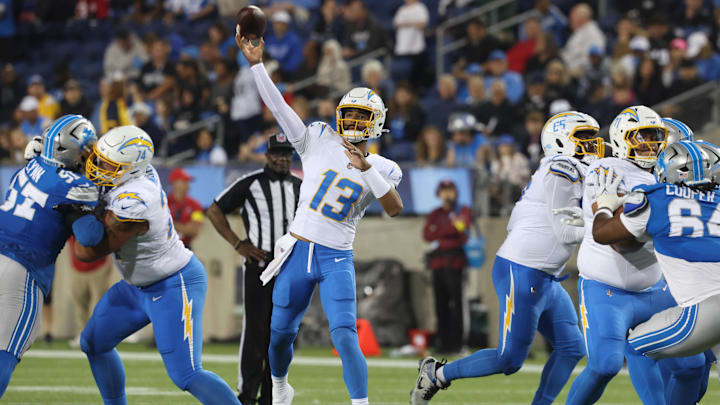 Jul 31, 2025; Canton, Ohio, USA;  Los Angeles Chargers quarterback DJ Uiagalelei (13) passes against the Detroit Lions in the second half at Tom Benson Hall of Fame Stadium. Mandatory Credit: Charles LeClaire-Imagn Images