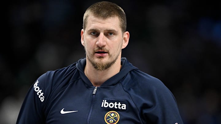 Dec 23, 2025; Dallas, Texas, USA; Denver Nuggets center Nikola Jokic (15) looks on before the game between the Mavericks and the Nuggets at the American Airlines Center. Mandatory Credit: Jerome Miron-Imagn Images