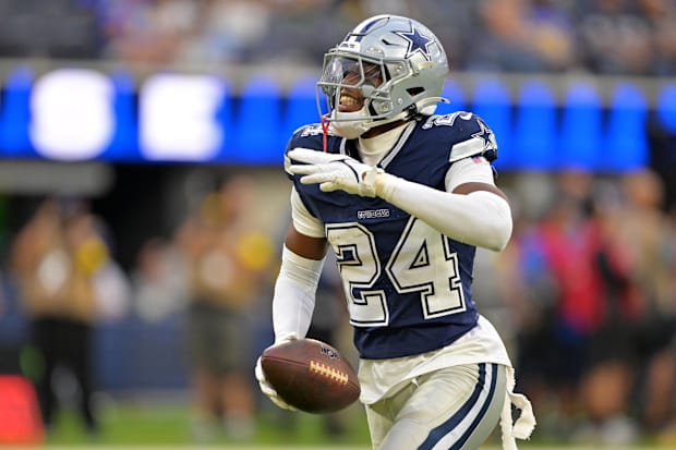 Dallas Cowboys safety Israel Mukuamu celebrates after an interception during the second half against the Los Angeles Rams.