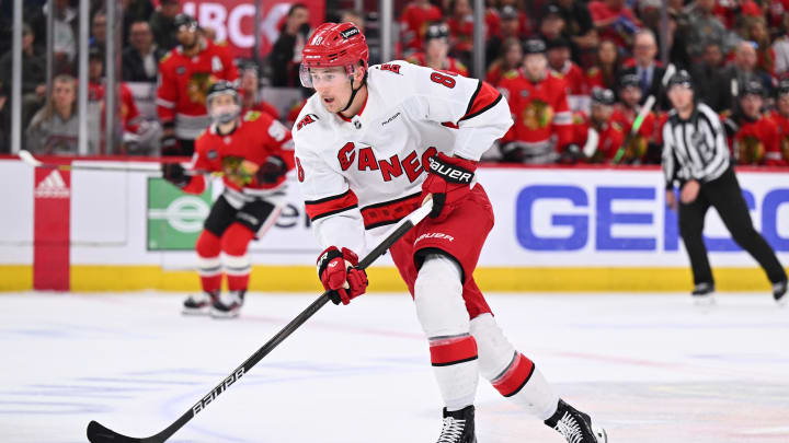 Apr 14, 2024; Chicago, Illinois, USA;  Carolina Hurricanes forward Martin Necas (88) controls the puck in the second period against the Chicago Blackhawks at United Center. Mandatory Credit: Jamie Sabau-USA TODAY Sports